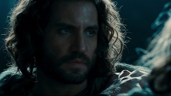 Movie still from “Wrath of the Titans” (2012), directed by Jonathan Liebesman – A person with long hair and a beard; Close Up shot, Over the shoulder angle