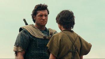 Movie still from “Wrath of the Titans” (2012), directed by Jonathan Liebesman – A man and a young boy in roman clothes; Medium shot, Over the shoulder angle