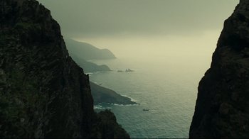 Movie still from “Wrath of the Titans” (2012), directed by Jonathan Liebesman – A view of a body of water from a cliff; Extreme Wide shot, High angle