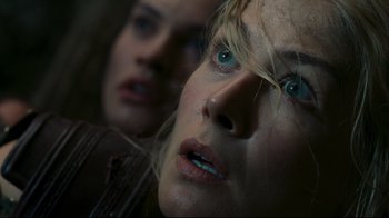 Movie still from “Wrath of the Titans” (2012), directed by Jonathan Liebesman – A woman's eyes and mouth as she stares ahead; Close Up shot, Overhead angle