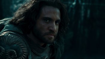 Movie still from “Wrath of the Titans” (2012), directed by Jonathan Liebesman – A person with long dark hair; Close Up shot, Over the shoulder angle