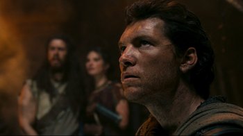 Movie still from “Wrath of the Titans” (2012), directed by Jonathan Liebesman – A person looking up at something; Close Up shot, Low angle