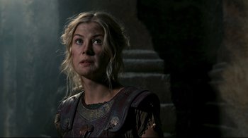 Movie still from “Wrath of the Titans” (2012), directed by Jonathan Liebesman – A person wearing a costume near a wall; Close Up shot, Low angle