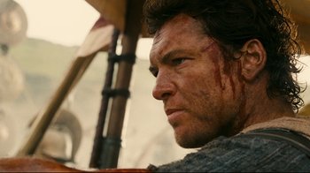 Movie still from “Wrath of the Titans” (2012), directed by Jonathan Liebesman – A man with blood on his face; Close Up shot, Low angle