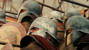 Movie still from “Wrath of the Titans” (2012), directed by Jonathan Liebesman – A group of roman soldiers wearing helmets and holding their hands behind their backs; Close Up shot, High angle