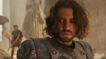 Movie still from “Wrath of the Titans” (2012), directed by Jonathan Liebesman – A person wearing a suit of armor; Close Up shot, Over the shoulder angle
