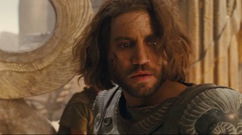 Movie still from “Wrath of the Titans” (2012), directed by Jonathan Liebesman – A person with long brown hair; Close Up shot, Over the shoulder angle