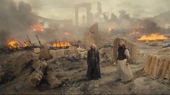 Movie still from “Wrath of the Titans” (2012), directed by Jonathan Liebesman – Two men standing in the middle of a destroyed city; Wide shot, High angle