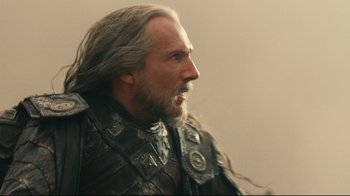 Movie still from “Wrath of the Titans” (2012), directed by Jonathan Liebesman – A person with long grey hair; Close Up shot, Low angle