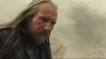 Movie still from “Wrath of the Titans” (2012), directed by Jonathan Liebesman – A person with long hair and a beard; Close Up shot, Low angle