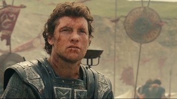 Movie still from “Wrath of the Titans” (2012), directed by Jonathan Liebesman – A person wearing armor; Close Up shot, Low angle