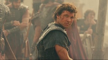 Movie still from “Wrath of the Titans” (2012), directed by Jonathan Liebesman – A person wearing armor; Close Up shot, Over the shoulder angle