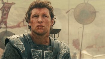 Movie still from “Wrath of the Titans” (2012), directed by Jonathan Liebesman – A person wearing armor; Close Up shot, Low angle