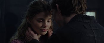 Movie still from “Apostle” (2018), directed by Gareth Evans – A man and a woman are looking into each others eyes; Close Up shot, Over the shoulder angle