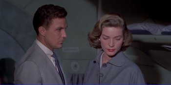 Movie still from “Written on the Wind” (1956), directed by Douglas Sirk – A man and a woman standing next to each other; Close Up shot, Low angle