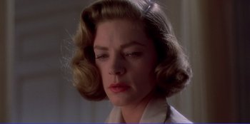 Movie still from “Written on the Wind” (1956), directed by Douglas Sirk – A person wearing a dress shirt; Close Up shot, Low angle