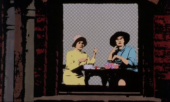 Movie still from “Yellow Submarine” (1968), directed by George Dunning – Two women sitting at a table in front of a wall; Wide shot, Low angle