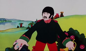 Movie still from “Yellow Submarine” (1968), directed by George Dunning – A cartoon of a man in a black jacket and red pants standing in front of a field; Medium shot, Low angle