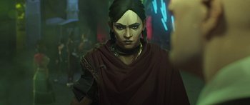 Movie still from “Arcane” (2021), created by Alex Yee – An image of a woman with a green hair; Close Up shot, Over the shoulder angle