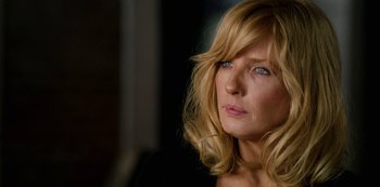 Movie still from “Yellowstone” (2018), created by John Linson – A person with long blonde hair; Close Up shot, Over the shoulder angle