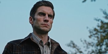 Movie still from “Yellowstone” (2018), created by John Linson – A person wearing a plaid shirt; Close Up shot, Low angle
