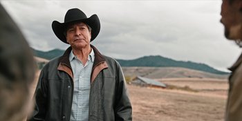 Movie still from “Yellowstone” (2018), created by John Linson – A man in a cowboy hat and a leather jacket; Medium shot, Low angle