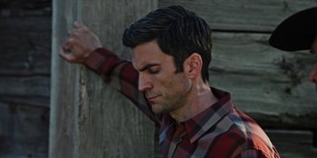 Movie still from “Yellowstone” (2018), created by John Linson – A person wearing a plaid shirt; Close Up shot, Low angle