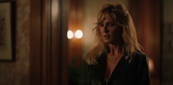 Movie still from “Yellowstone” (2018), created by John Linson – A woman with blonde hair and a leather jacket; Close Up shot, Over the shoulder angle
