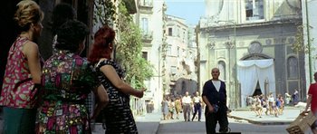 Movie still from “Yesterday, Today and Tomorrow” (1963), directed by Vittorio De Sica – A group of people walking down a street; Wide shot, High angle