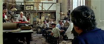 Movie still from “Yesterday, Today and Tomorrow” (1963), directed by Vittorio De Sica – A group of men sitting at tables in a room; Wide shot, High angle