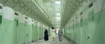 Movie still from “Yesterday, Today and Tomorrow” (1963), directed by Vittorio De Sica – A group of people walking down a long hallway; Wide shot, High angle