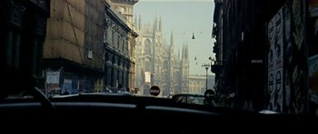 Movie still from “Yesterday, Today and Tomorrow” (1963), directed by Vittorio De Sica – A view of a cathedral from a car window; Extreme Wide shot, High angle
