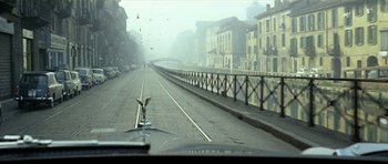 Movie still from “Yesterday, Today and Tomorrow” (1963), directed by Vittorio De Sica – A bird sitting on the side of a bridge; Wide shot, High angle