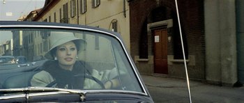 Movie still from “Yesterday, Today and Tomorrow” (1963), directed by Vittorio De Sica – A woman sitting in the driver's seat of a car; Close Up shot, Low angle