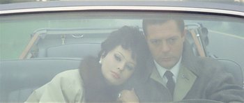 Movie still from “Yesterday, Today and Tomorrow” (1963), directed by Vittorio De Sica – A man and a woman sitting in the back of a car; Close Up shot, High angle