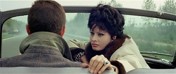 Movie still from “Yesterday, Today and Tomorrow” (1963), directed by Vittorio De Sica – A man and a woman sitting in a car talking to each other; Close Up shot, Over the shoulder angle