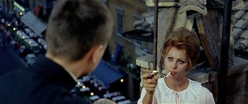 Movie still from “Yesterday, Today and Tomorrow” (1963), directed by Vittorio De Sica – A young woman holding a cigarette in her hand; Close Up shot, Over the shoulder angle