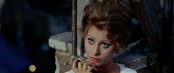 Movie still from “Yesterday, Today and Tomorrow” (1963), directed by Vittorio De Sica – A person with a cell phone; Close Up shot, High angle