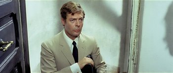 Movie still from “Yesterday, Today and Tomorrow” (1963), directed by Vittorio De Sica – A person wearing a suit and tie; Close Up shot, High angle