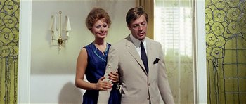 Movie still from “Yesterday, Today and Tomorrow” (1963), directed by Vittorio De Sica – A man and a woman standing next to each other; Medium shot, Low angle