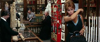 Movie still from “Yesterday, Today and Tomorrow” (1963), directed by Vittorio De Sica – A man and a woman looking at a painting in an antique store; Medium shot, Over the shoulder angle