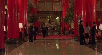 Movie still from “Yi Yi” (2000), directed by Edward Yang – A group of people standing in front of a large room; Extreme Wide shot, Low angle