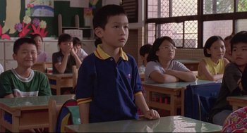 Movie still from “Yi Yi” (2000), directed by Edward Yang – A group of children sitting at a table in a classroom; Medium shot, High angle