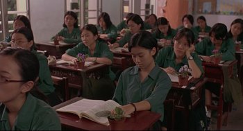 Movie still from “Yi Yi” (2000), directed by Edward Yang – A group of people sitting at a table reading books; Medium shot, High angle