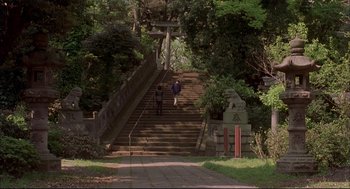 Movie still from “Yi Yi” (2000), directed by Edward Yang – Two people are walking up a set of stairs; Extreme Wide shot, High angle