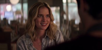 Movie still from “You” (2018), created by Sera Gamble – A beautiful young lady sitting in front of a mirror; Close Up shot, Over the shoulder angle