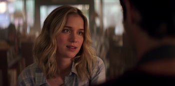 Movie still from “You” (2018), created by Sera Gamble – A person sitting in front of a window; Close Up shot, Over the shoulder angle