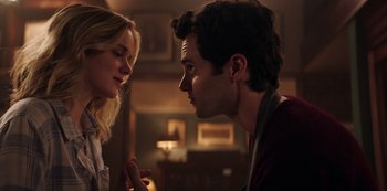 Movie still from “You” (2018), created by Sera Gamble – A man and a woman looking at one another; Close Up shot, Over the shoulder angle