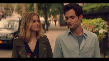 Movie still from “You” (2018), created by Sera Gamble – A man and a woman standing next to each other on a sidewalk; Close Up shot, Over the shoulder angle