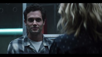 Movie still from “You” (2018), created by Sera Gamble – A man and a woman looking at one another in a mirror; Close Up shot, Over the shoulder angle